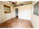 Bonus room featuring tile floors, a window with woven shades, and an interior doorway at 2415 Goldenrod St, Sarasota, FL 34239