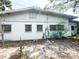 Back exterior of home showcasing white painted walls and window details at 2415 Goldenrod St, Sarasota, FL 34239