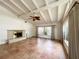 Bright living room featuring tile floors, fireplace, ceiling fan, and large windows at 2415 Goldenrod St, Sarasota, FL 34239
