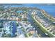 Lush waterfront community with homes along winding canals near a large body of water at 4116 4Th Ne Ave, Bradenton, FL 34208
