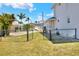Fenced backyard with an open gate shows access to other parts of the yard at 4116 4Th Ne Ave, Bradenton, FL 34208