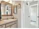 Well-lit bathroom featuring a vanity with decorative mirrors and ample storage, offering a clean and functional space at 4116 4Th Ne Ave, Bradenton, FL 34208