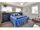 Cozy bedroom with a plush bed, dark wood dressers, and soft natural light, creating a relaxing retreat at 4116 4Th Ne Ave, Bradenton, FL 34208