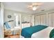 Bedroom featuring hardwood floors, two closets, and a cozy sitting area at 4116 4Th Ne Ave, Bradenton, FL 34208