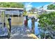 Wooden dock with weathered planks provides access to the waterfront for fishing or boating at 4116 4Th Ne Ave, Bradenton, FL 34208