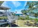 Backyard with stairs leading to a deck, providing waterfront access at 4116 4Th Ne Ave, Bradenton, FL 34208
