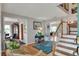 The foyer features wood flooring and an open staircase that enhances the home's charm at 4116 4Th Ne Ave, Bradenton, FL 34208