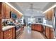 Spacious open kitchen with wooden cabinets, stainless steel appliances, and tile flooring at 4116 4Th Ne Ave, Bradenton, FL 34208