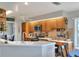 Well-lit kitchen features stainless steel appliances, tile countertops, and wooden cabinets at 4116 4Th Ne Ave, Bradenton, FL 34208