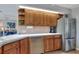 Bright kitchen featuring wooden cabinets, stainless steel appliances and tile countertops at 4116 4Th Ne Ave, Bradenton, FL 34208