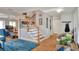 The home's living area features comfortable sofas, a ceiling fan, and cozy decor at 4116 4Th Ne Ave, Bradenton, FL 34208