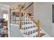 Bright staircase featuring wood treads, white risers, and a classic wood railing, offering access to upper levels of the home at 4116 4Th Ne Ave, Bradenton, FL 34208