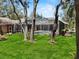 Spacious backyard with green grass and enclosed pool area for private outdoor enjoyment at 6007 Hammock Hill Ave, Lithia, FL 33547