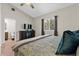 This bedroom offers neutral walls, high ceilings and carpeted floors for comfortable living at 6007 Hammock Hill Ave, Lithia, FL 33547