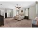 Large bedroom with ceiling fan, adjoining entry to bathroom and closet at 6007 Hammock Hill Ave, Lithia, FL 33547