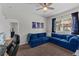 This inviting bedroom features a comfortable blue sectional sofa and neutral decor at 6007 Hammock Hill Ave, Lithia, FL 33547