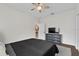 Bedroom with a full-sized bed, tv, and a neutral color scheme at 6007 Hammock Hill Ave, Lithia, FL 33547