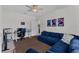 This inviting bedroom features a comfortable blue sectional sofa and neutral decor at 6007 Hammock Hill Ave, Lithia, FL 33547