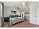 This bedroom offers neutral walls, high ceilings and carpeted floors for comfortable living at 6007 Hammock Hill Ave, Lithia, FL 33547