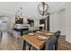 Open-concept design with dining area, kitchen island with seating, and stylish pendant lighting at 6007 Hammock Hill Ave, Lithia, FL 33547