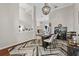 Elegant dining room with modern chandelier, stylish decor and a view into other rooms at 6007 Hammock Hill Ave, Lithia, FL 33547