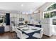 A modern kitchen boasting stainless steel appliances, stylish blue cabinets, and an island at 6007 Hammock Hill Ave, Lithia, FL 33547