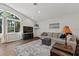 Spacious living room with vaulted ceiling and a large window providing natural light at 6007 Hammock Hill Ave, Lithia, FL 33547