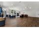 Open floor plan with hardwood floors connecting the kitchen, living room, and entry at 6007 Hammock Hill Ave, Lithia, FL 33547