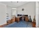 Bright home office with hardwood floors, neutral walls, and a desk setup at 6007 Hammock Hill Ave, Lithia, FL 33547