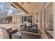 Covered patio area with woven chairs and access to enclosed pool at 6007 Hammock Hill Ave, Lithia, FL 33547
