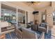 Covered outdoor patio area with comfortable seating and view of the enclosed pool area at 6007 Hammock Hill Ave, Lithia, FL 33547