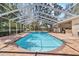 Screened-in pool with expansive deck, perfect for relaxation and outdoor enjoyment at 6007 Hammock Hill Ave, Lithia, FL 33547