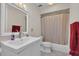 Well-lit bathroom with a vanity, mirror, toilet, and a tub/shower combo at 114 Windy Pl, Brandon, FL 33511