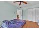 Bedroom with wood floors, a large closet, and a tranquil and serene ambiance at 114 Windy Pl, Brandon, FL 33511