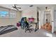 Bedroom featuring carpet flooring, a ceiling fan, and a gaming setup at 114 Windy Pl, Brandon, FL 33511