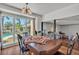 Sunny dining room with views of the backyard and hardwood floors, perfect for Gathering meals and gatherings at 114 Windy Pl, Brandon, FL 33511