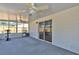 View of an enclosed sunroom with large windows and sliding door to outside area at 114 Windy Pl, Brandon, FL 33511