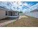 Well-kept backyard featuring a screened-in patio, brick accents, and white fencing for added privacy at 3425 San Moise Pl, Plant City, FL 33567