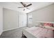 Bedroom featuring carpet, a ceiling fan, and a bright window at 3425 San Moise Pl, Plant City, FL 33567