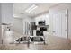 Spacious kitchen with a stainless steel refrigerator, white cabinets, and a large sink at 3425 San Moise Pl, Plant City, FL 33567