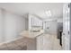Large kitchen with an island, stainless steel appliances, and tile flooring throughout at 3425 San Moise Pl, Plant City, FL 33567
