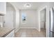 Bright kitchen with white cabinets, a window and stainless steel appliances at 3425 San Moise Pl, Plant City, FL 33567