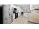 The bright kitchen features granite countertops and stainless steel appliances at 3425 San Moise Pl, Plant City, FL 33567