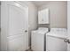 Convenient laundry room with washer, dryer, and storage at 3425 San Moise Pl, Plant City, FL 33567
