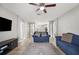 Open-concept living room featuring tile floors, comfortable seating, and natural light at 3425 San Moise Pl, Plant City, FL 33567