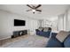 Bright living room features tile floors, neutral walls, and a ceiling fan at 3425 San Moise Pl, Plant City, FL 33567
