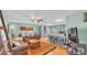 The living room shows hardwood floors, a ceiling fan, and an open concept with plenty of light at 619 Shady Nook Dr, Brandon, FL 33511