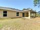 This backyard offers a covered patio, plenty of green space, and a serene outdoor environment at 12043 Centralia Rd, Weeki Wachee, FL 34614