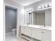 Bathroom featuring double sink vanity with white cabinetry and modern lighting at 12043 Centralia Rd, Weeki Wachee, FL 34614