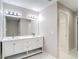 Bathroom featuring double sink vanity with white cabinetry and modern lighting at 12043 Centralia Rd, Weeki Wachee, FL 34614
